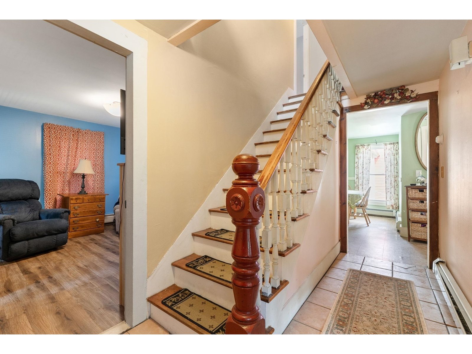Looking from front door towards 1st floor bedroom, stairs and dining area