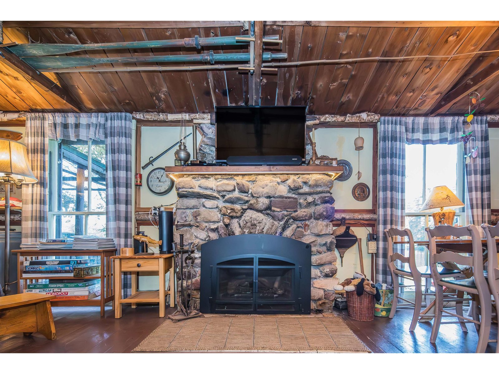 Living room with stone fireplace and gas insert