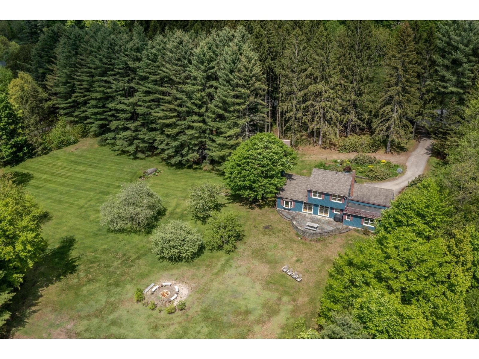 Expansive yard with firepit and lots of room for gardens