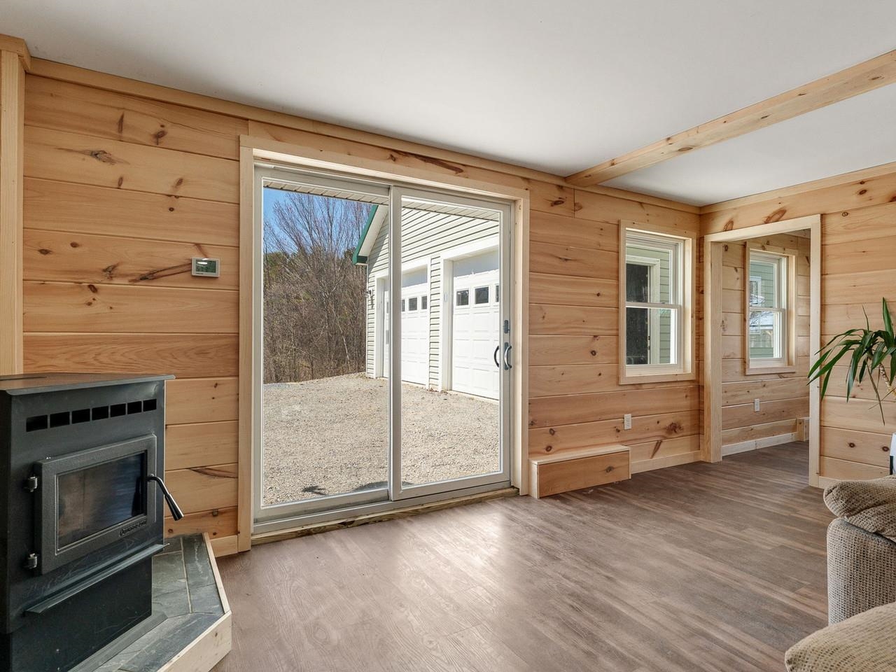 Pellet stove and sliding door