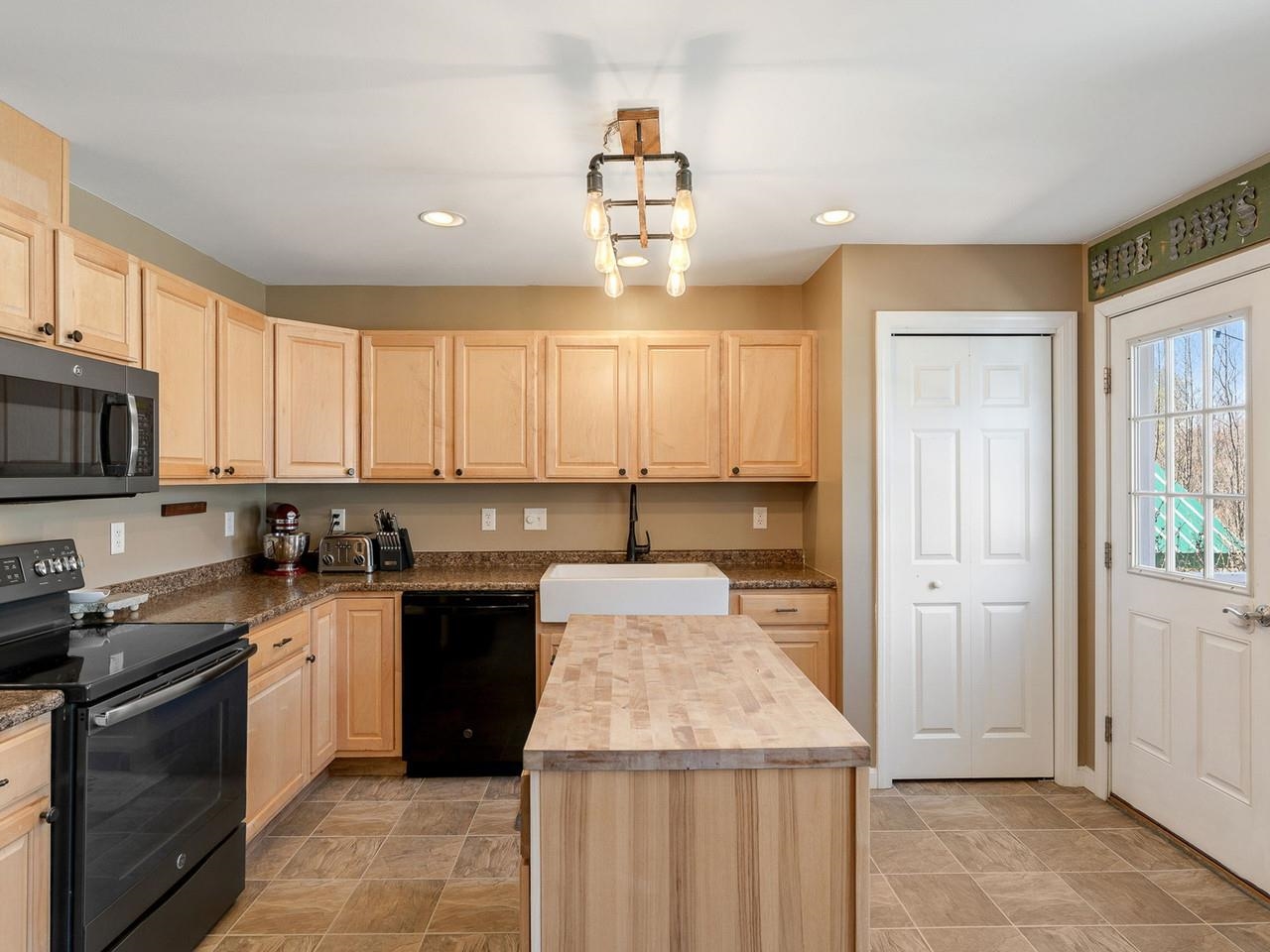 Kitchen with door to rear deck