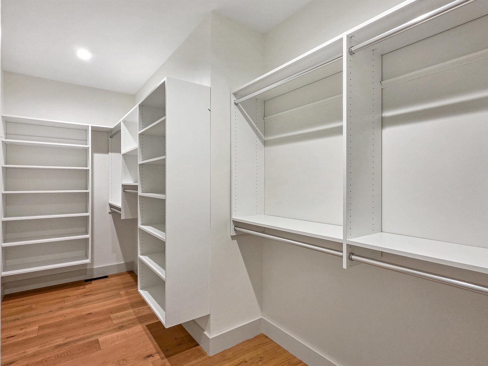 Expansive Walk-in Close with Custom Shelving