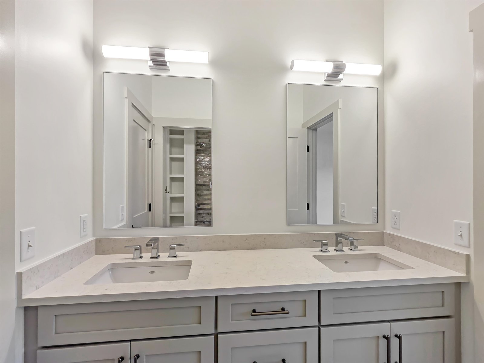 Designer Bathroom with Dual Square Vanites