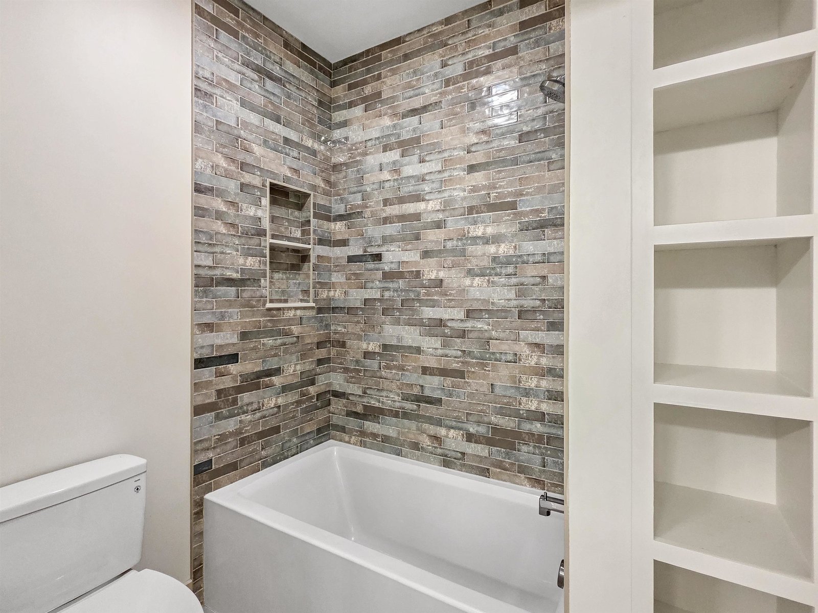 Elegant Tiled Shower wiith Custom Niches for Modern Convenience