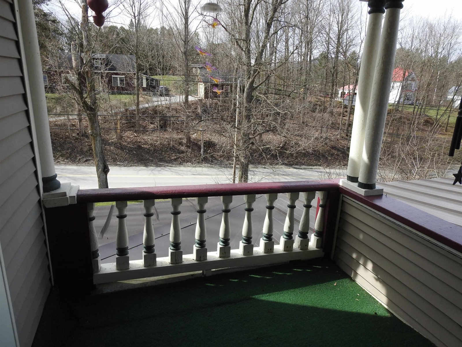 2nd floor covered porch off Primary Bedroom