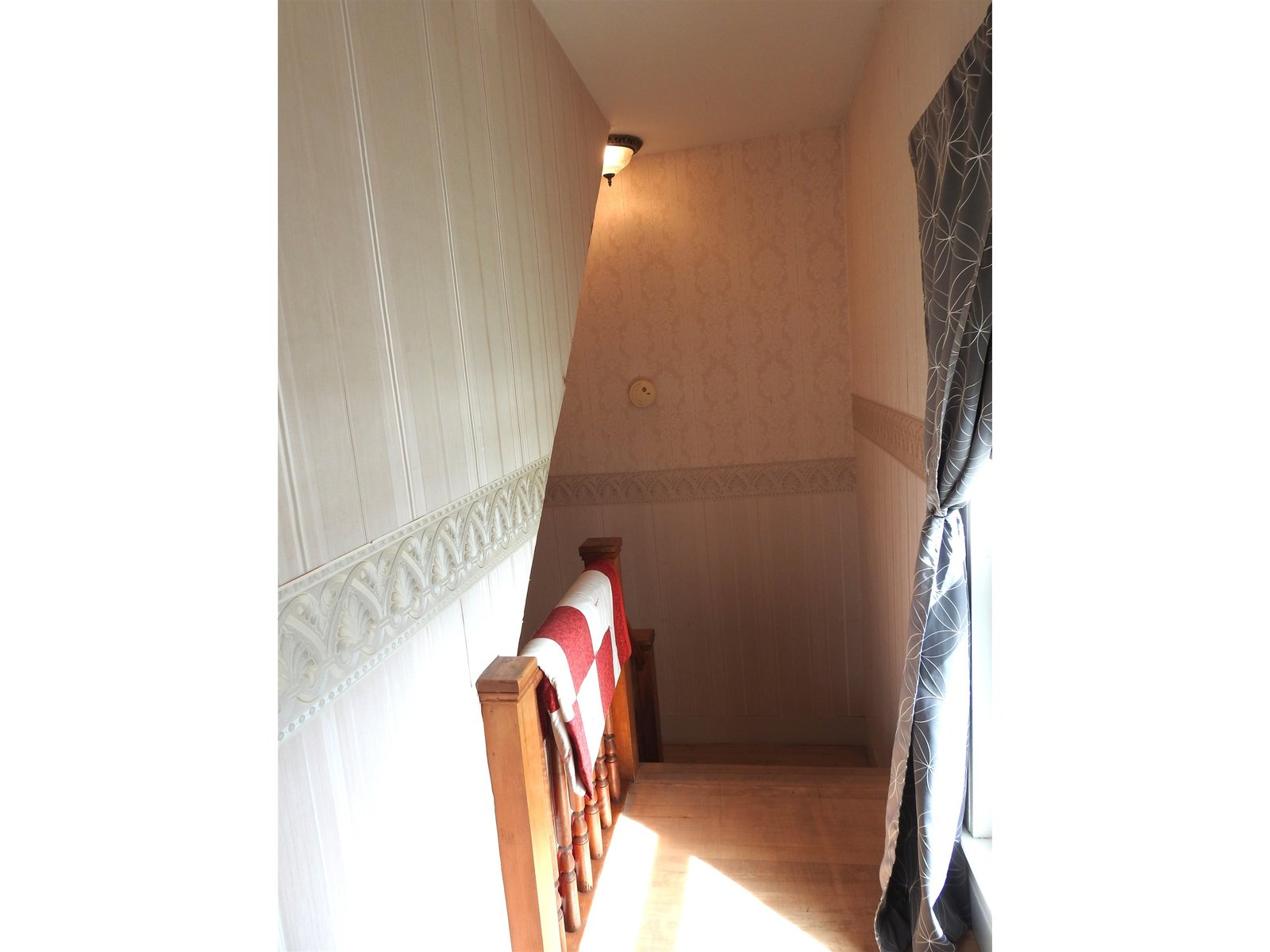 Stairs to the 1st floor from landing outside of Primary Bedroom
