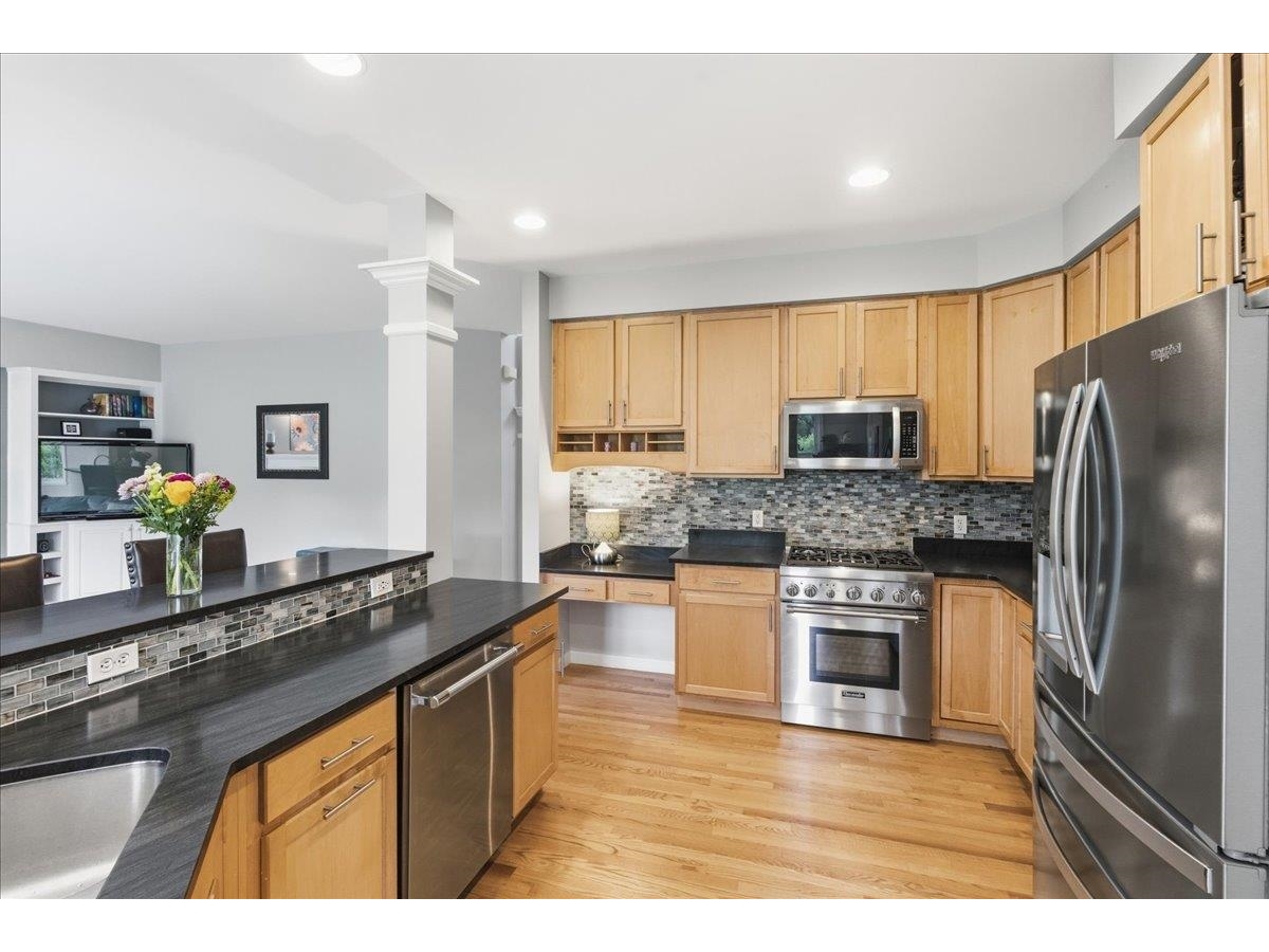 High end kitchen with Thermador gas range and dishwasher
