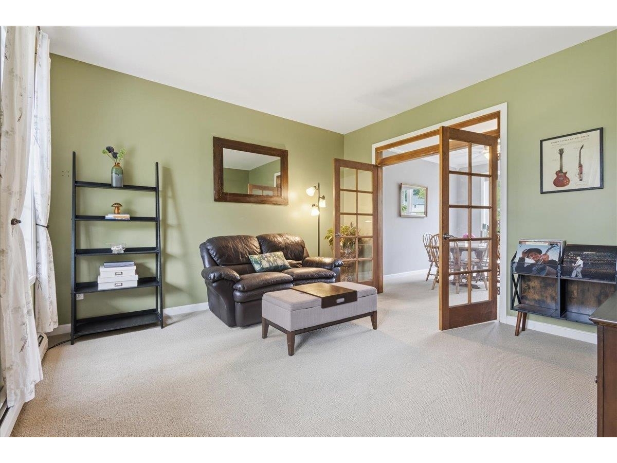 Living room flows to dining room with French doors