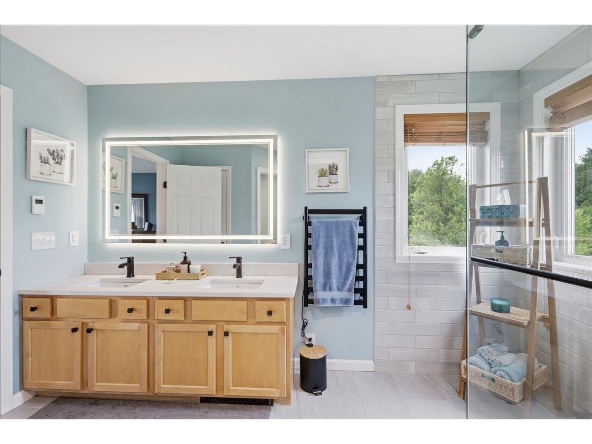 Well designed upscale bathroom with private water closet