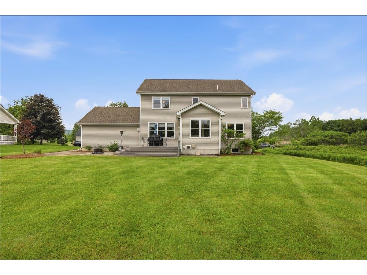 Huge level backyard with deck, patio, fire pit