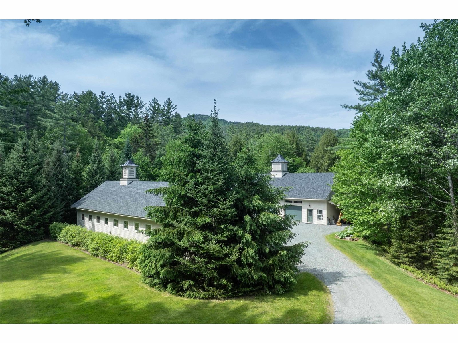 Heading to the 2- 4 bay + carriage houses on property