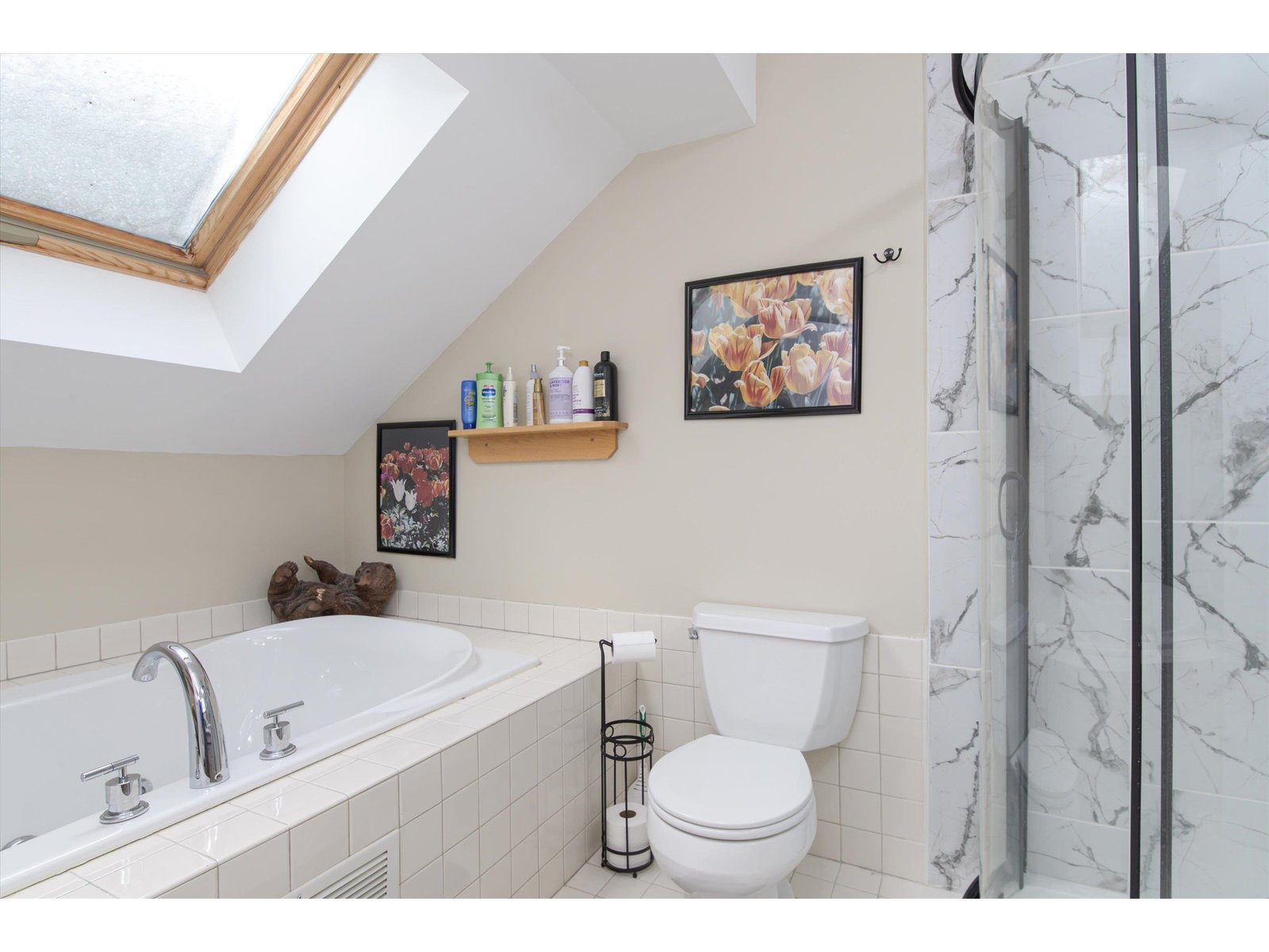 Skylit whirlpool tub with glass enclosed shower
