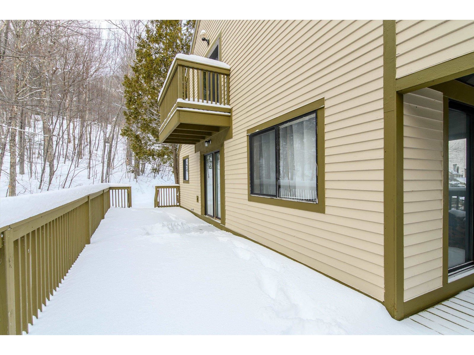 Large wrap around deck in private wooded setting