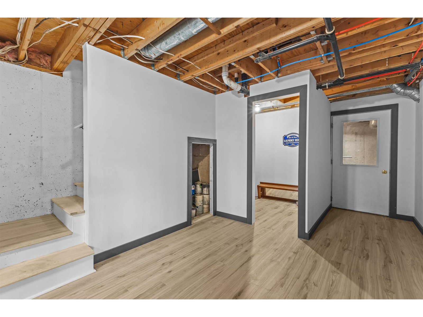 Lower level with finished flooring and walls.
