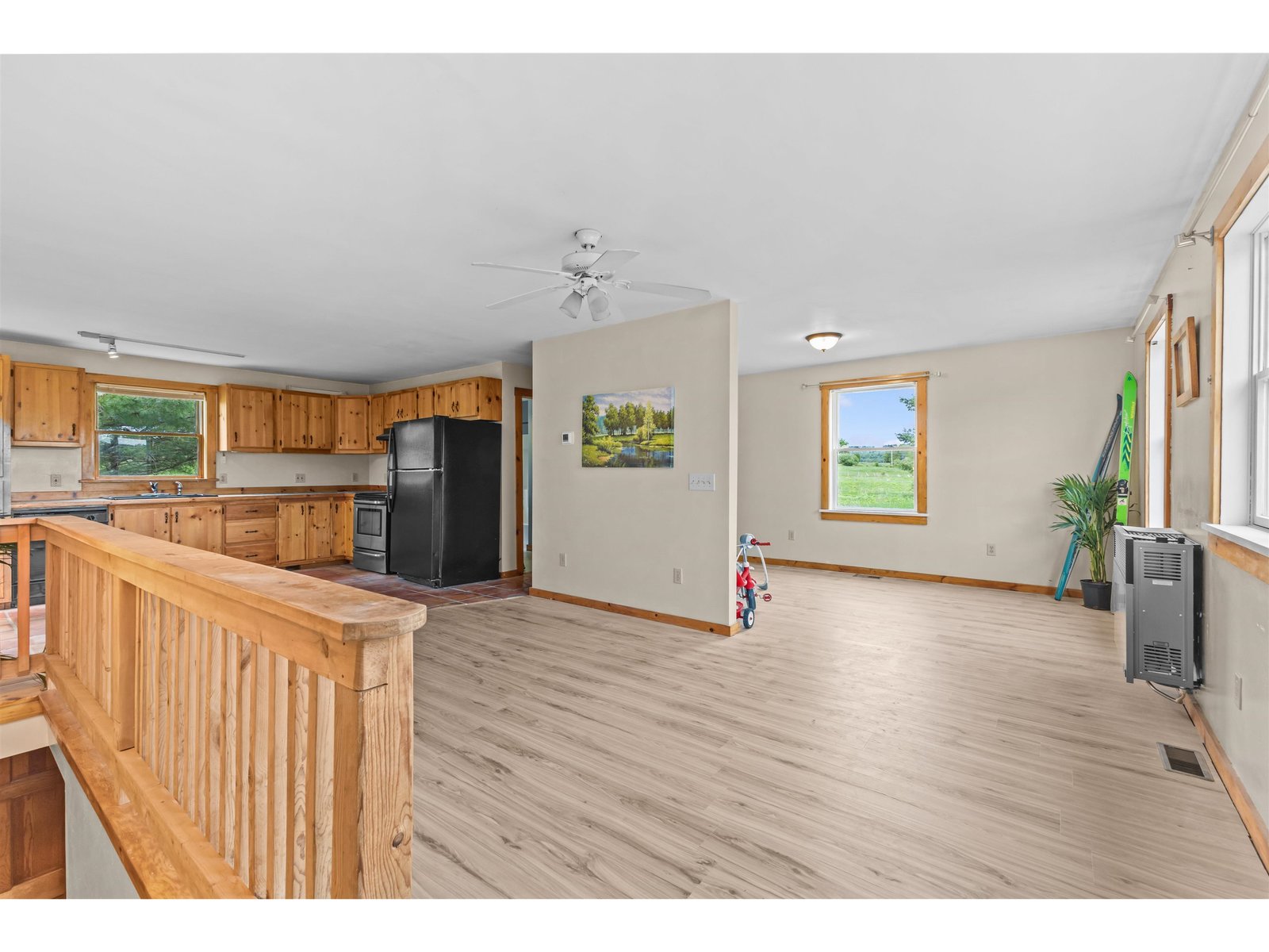Another photo shows the mixed use living/ dining areas.