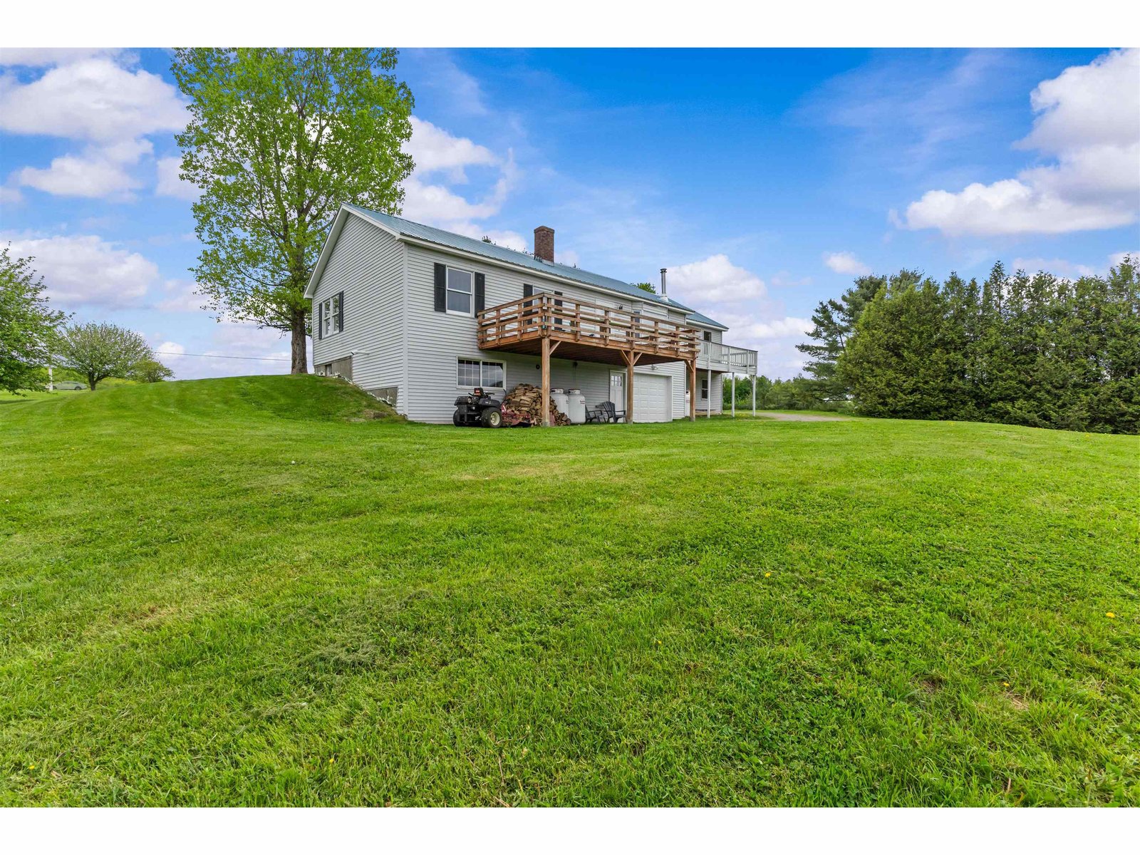 Hillside setting with rolling hills and natural areas around the home.