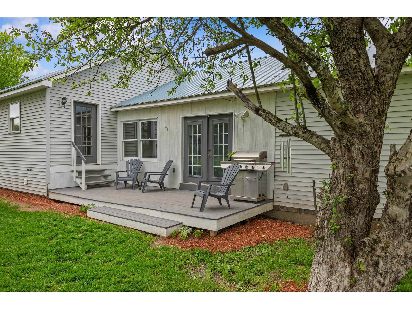 Spacious deck with main level entries to the home and apartment.