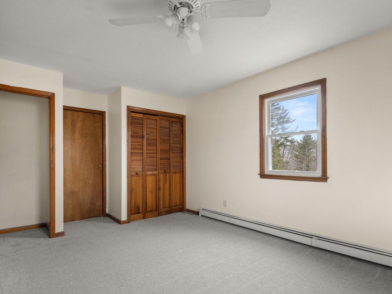 Door to Bath & Two Closets