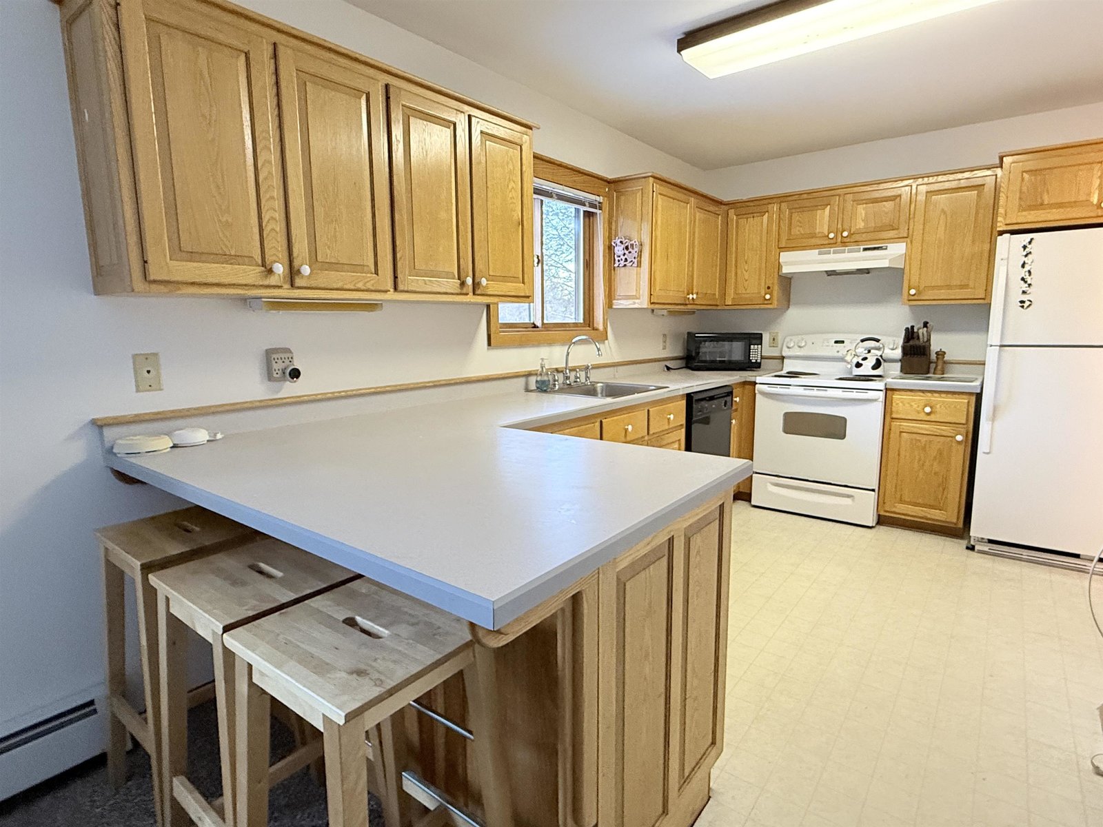 Large working kitchen, but room for company at the counter