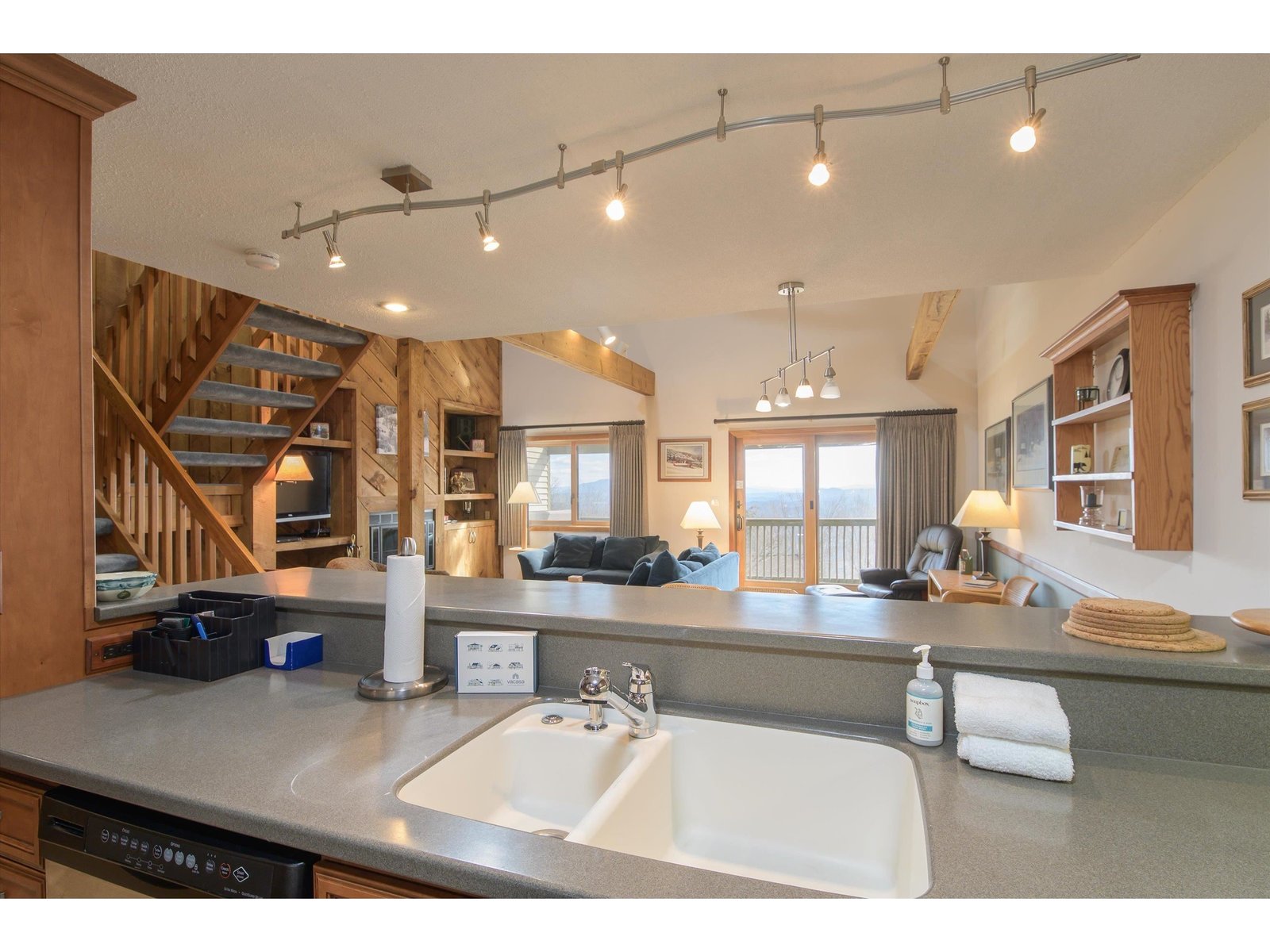 Kitchen overlooking breakfast bar and living areas