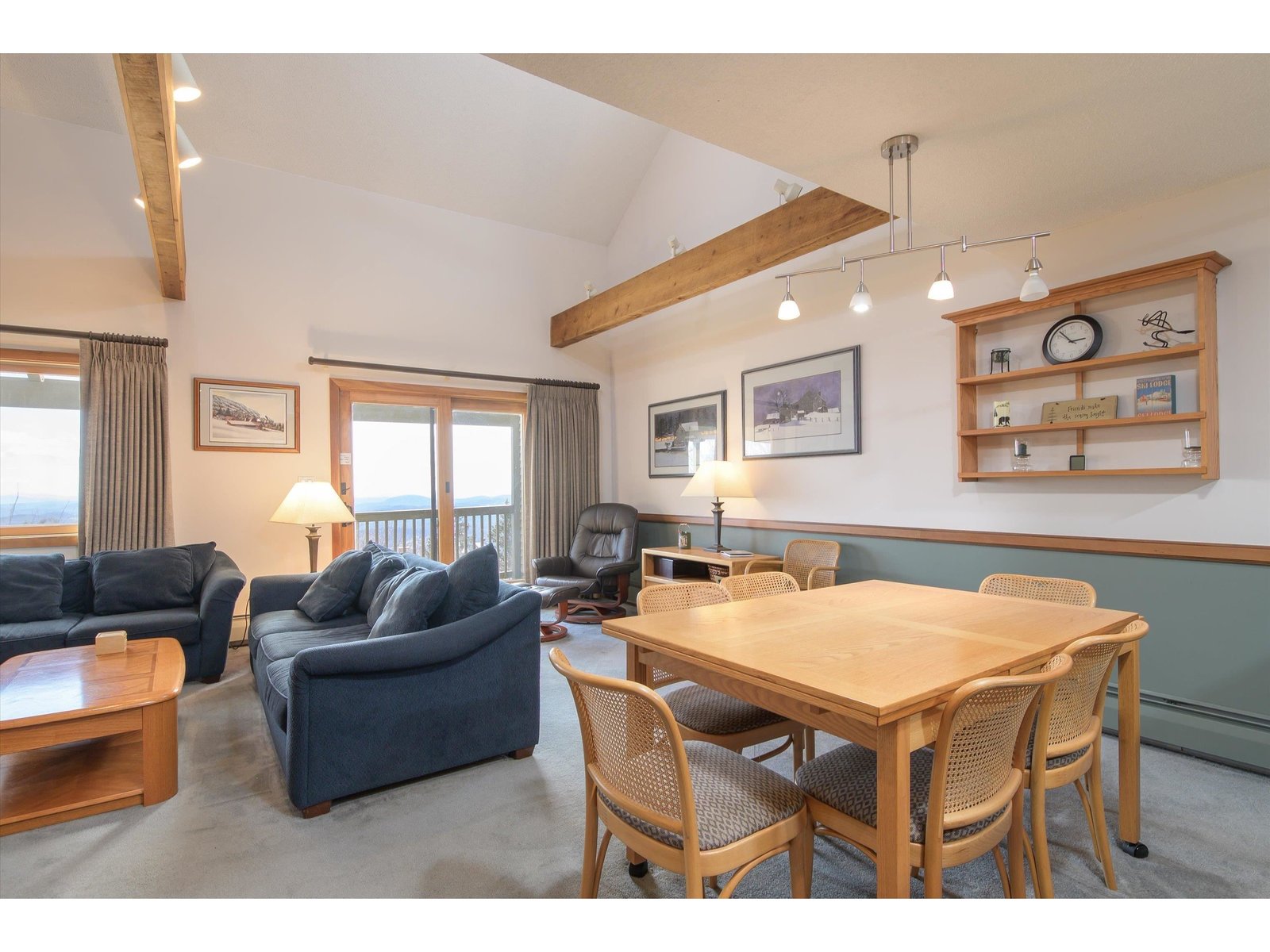 Living/dining areas leading out to covered deck