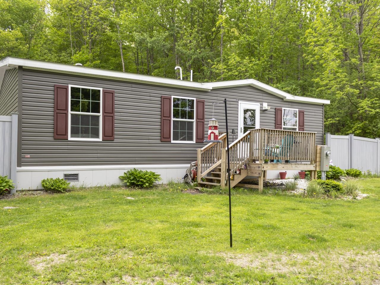 Sunny deck entry & lush yard