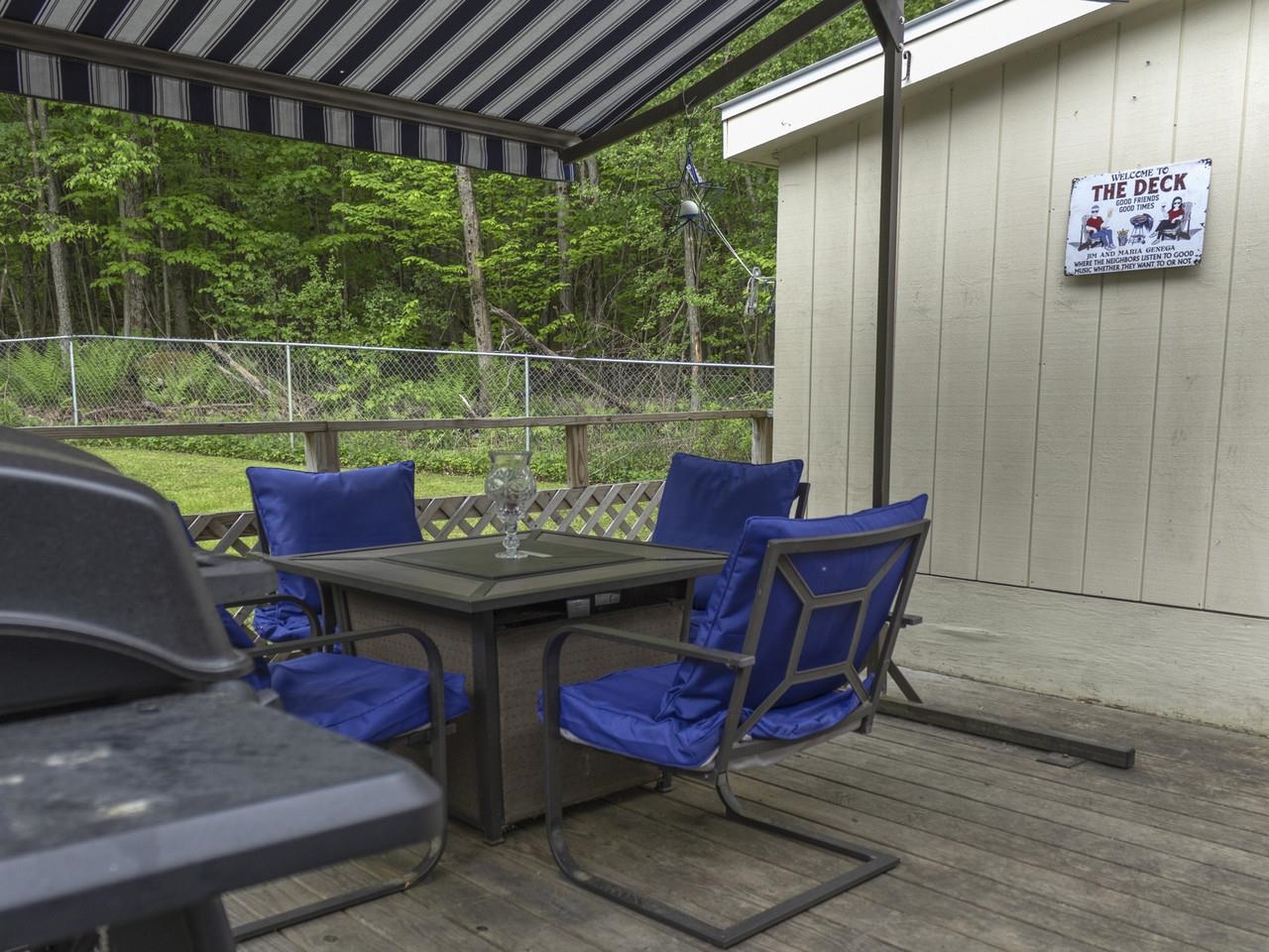 Covered deck with wooded view
