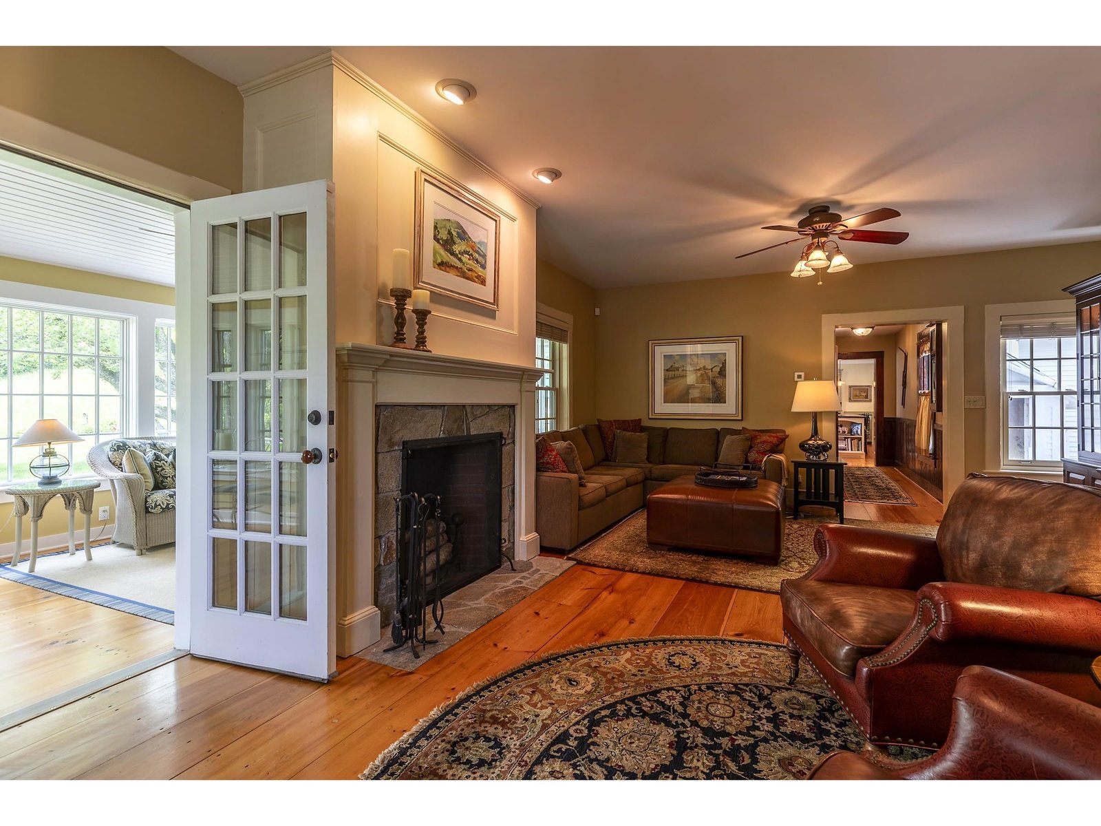 Living room with French doors to sun room.