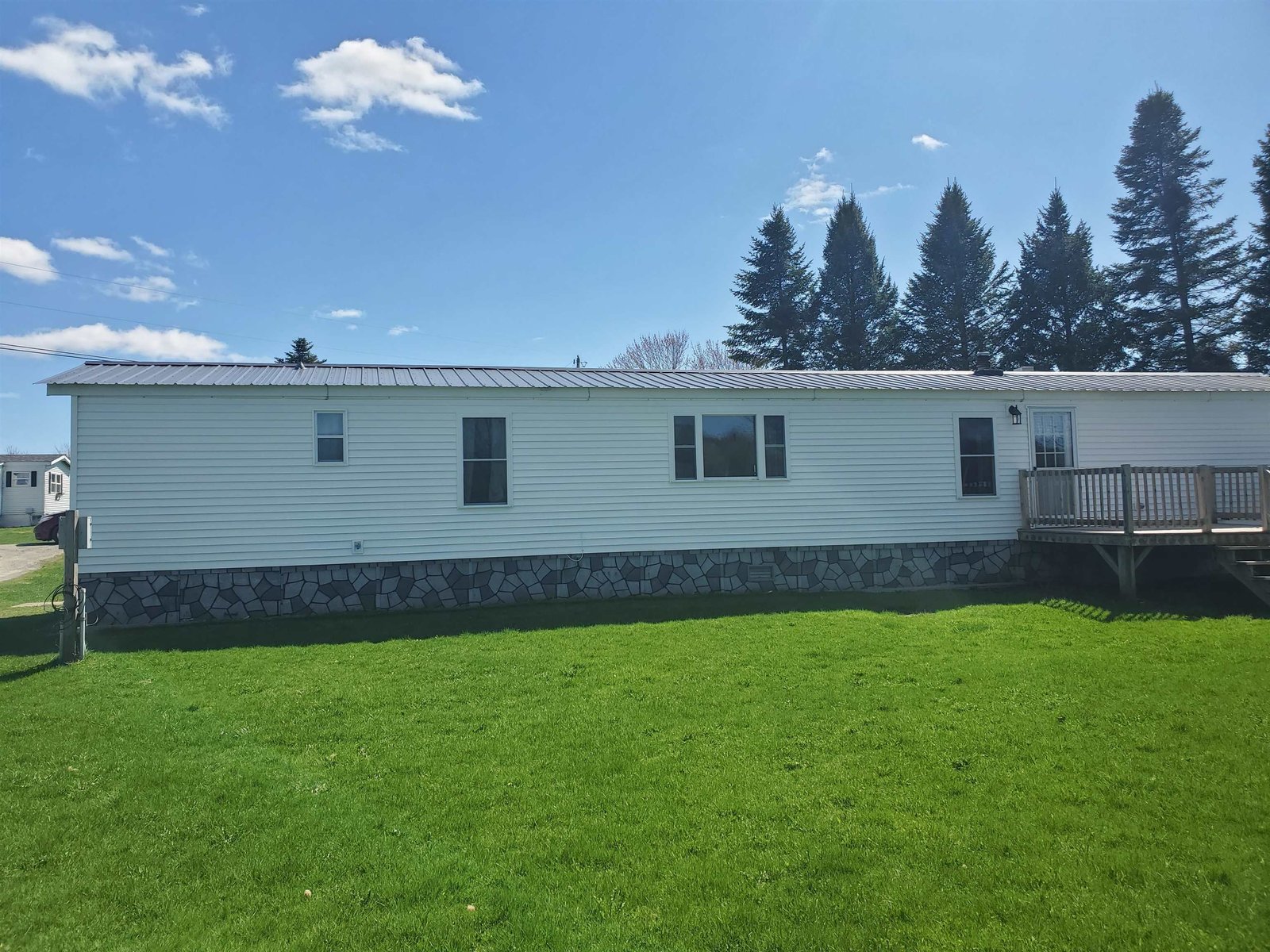 Back of home with deck