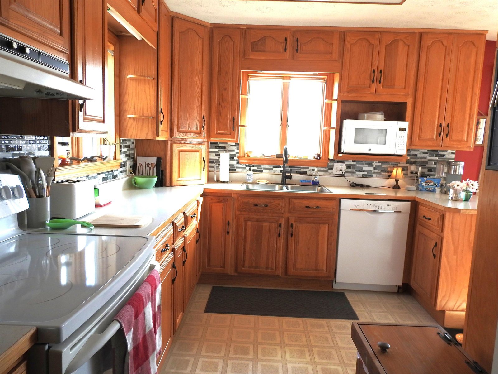 Kitchen from laundry area and door to rear porch