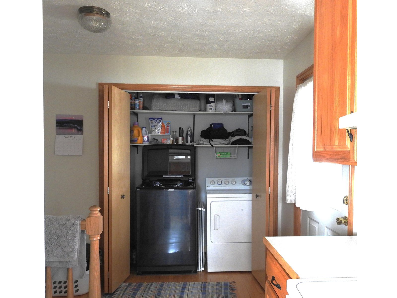 Laundry area with door to rear porch on the right