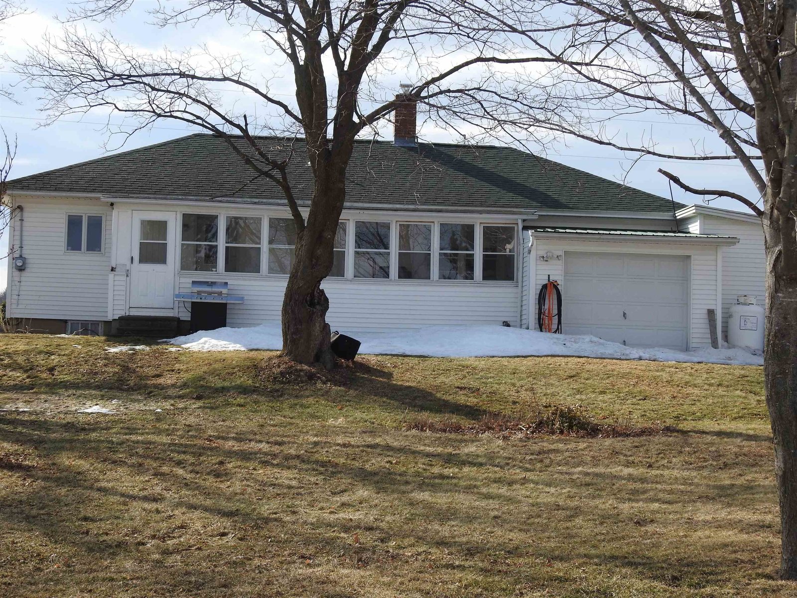 Rear of home with enclosed porch