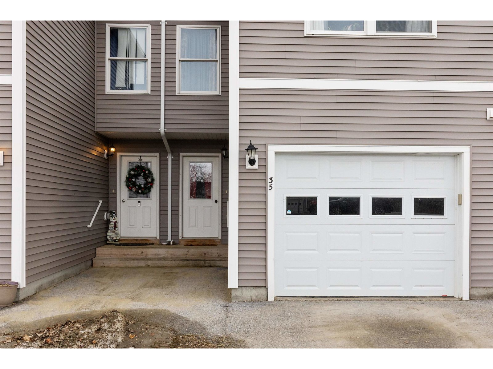 Attached one car garage with electric garage door opener
