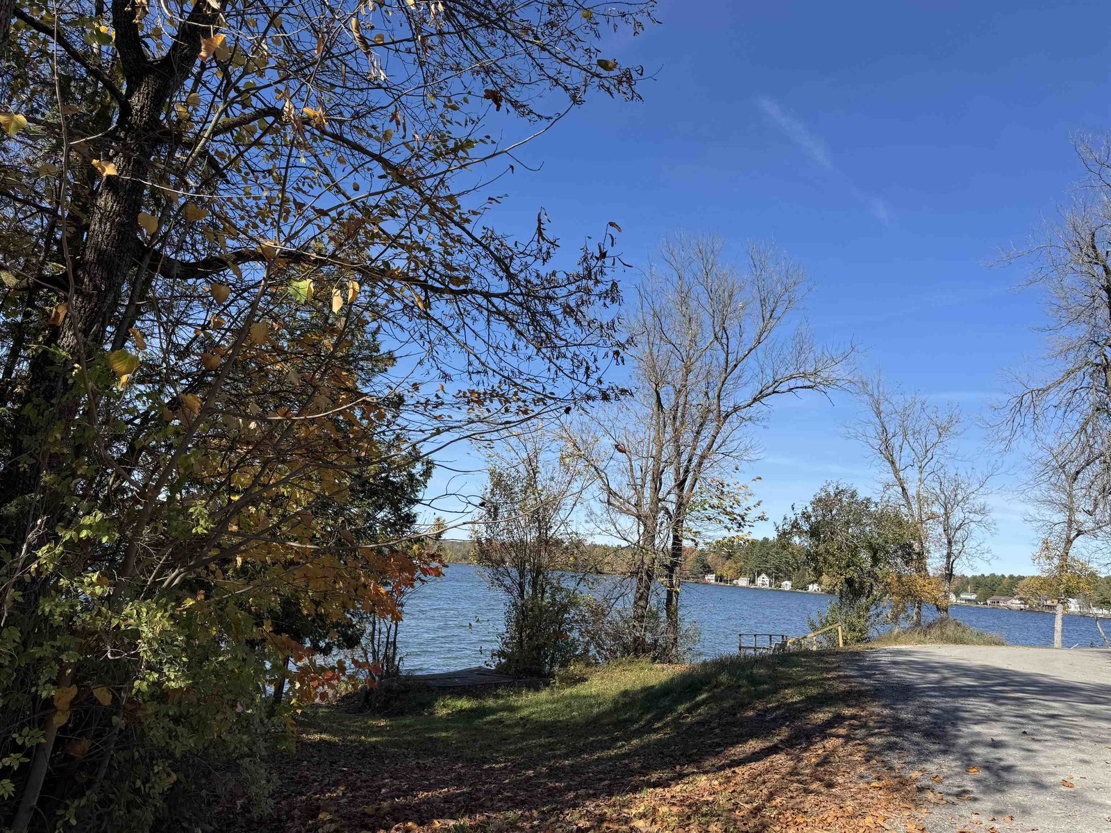 Lake view down the end of the street going towards the public beach .