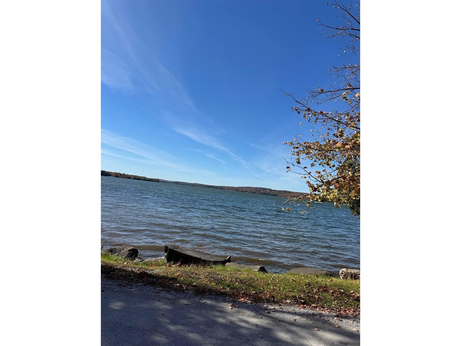 A beautiful lake view further down the street .