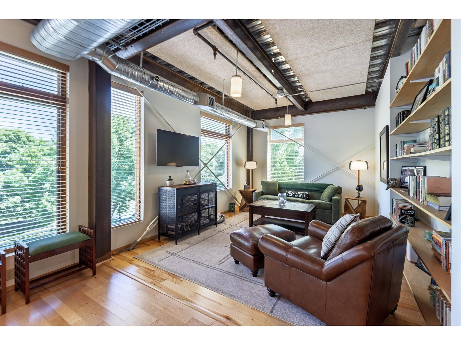 Formal living/dining area with view of the park and large windows