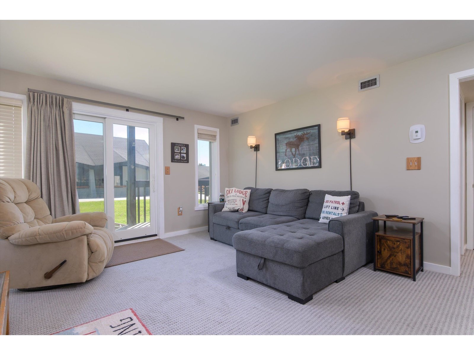 Living room with updated slider leading out to deck