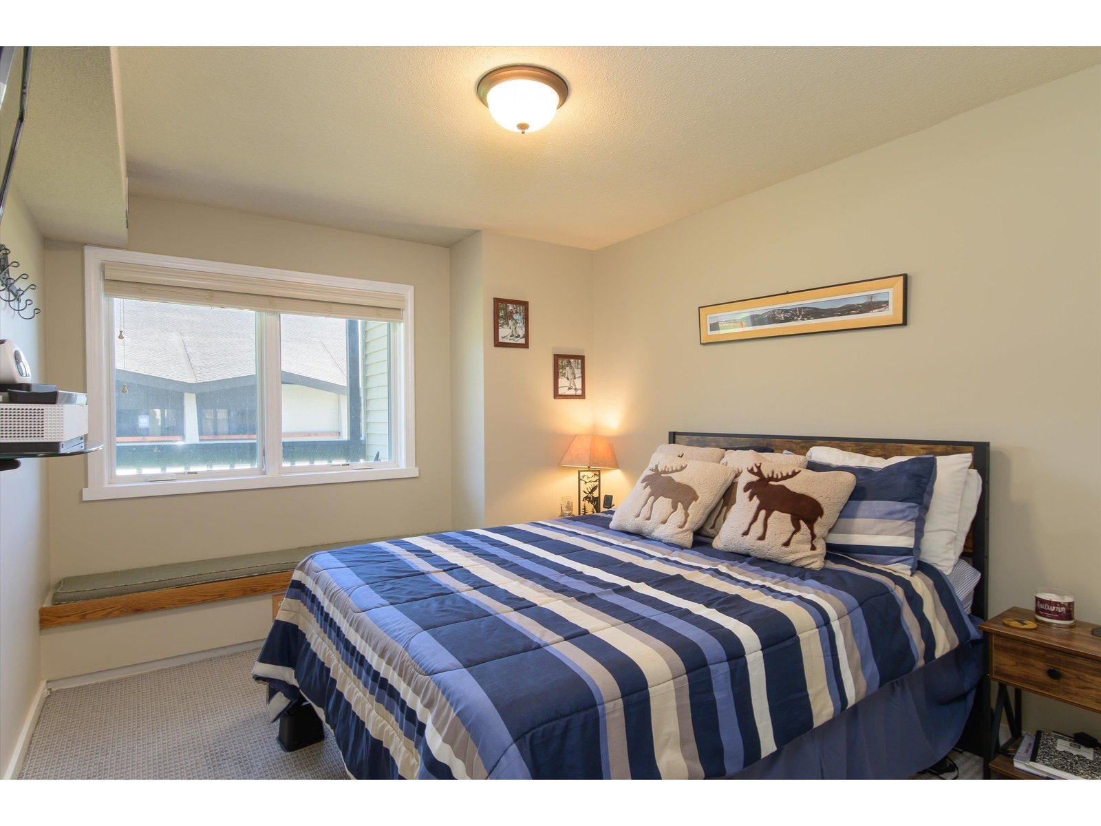 Well proportioned bedroom with updated window and window seat