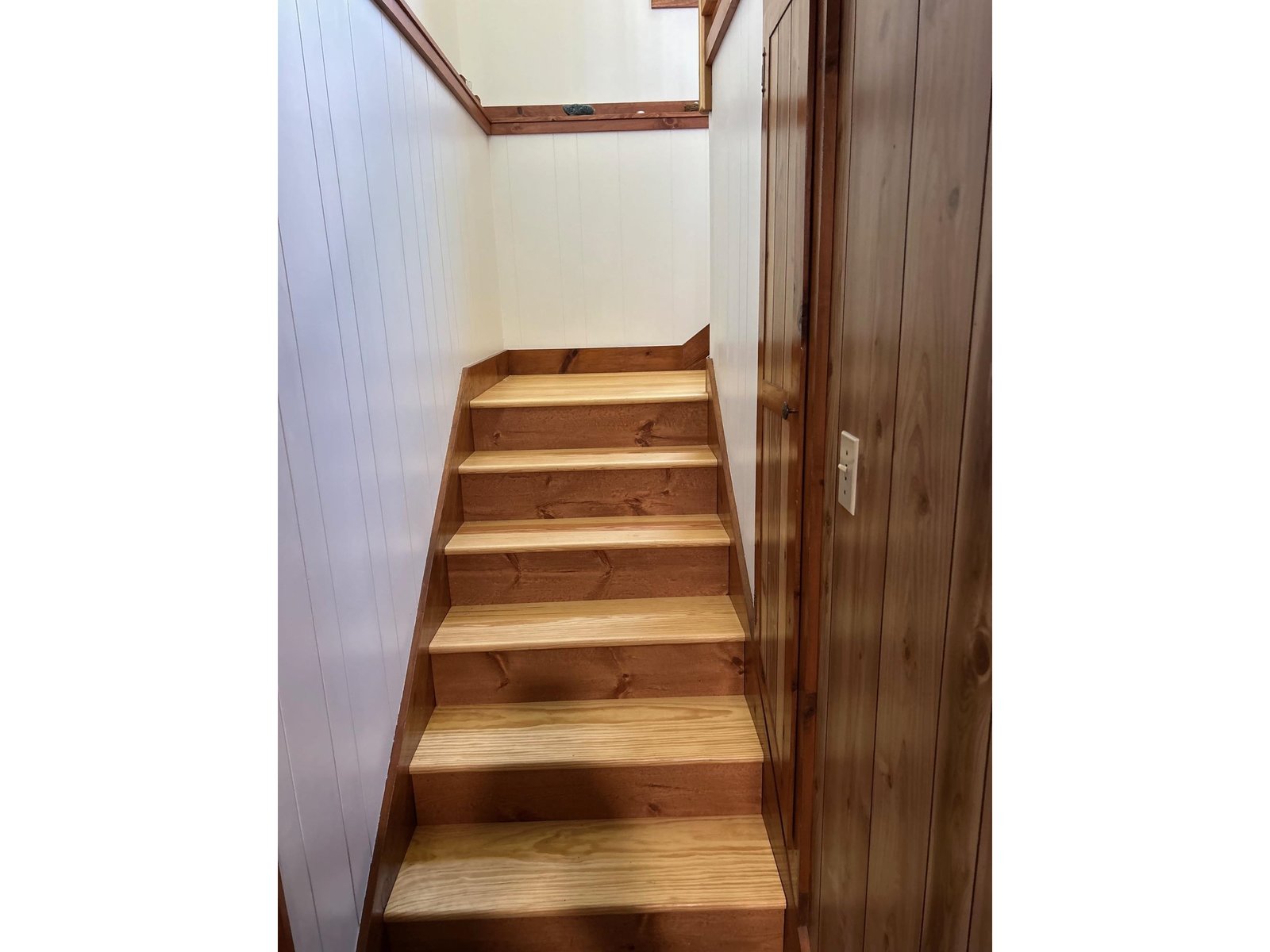 Stairs to upper level and garage