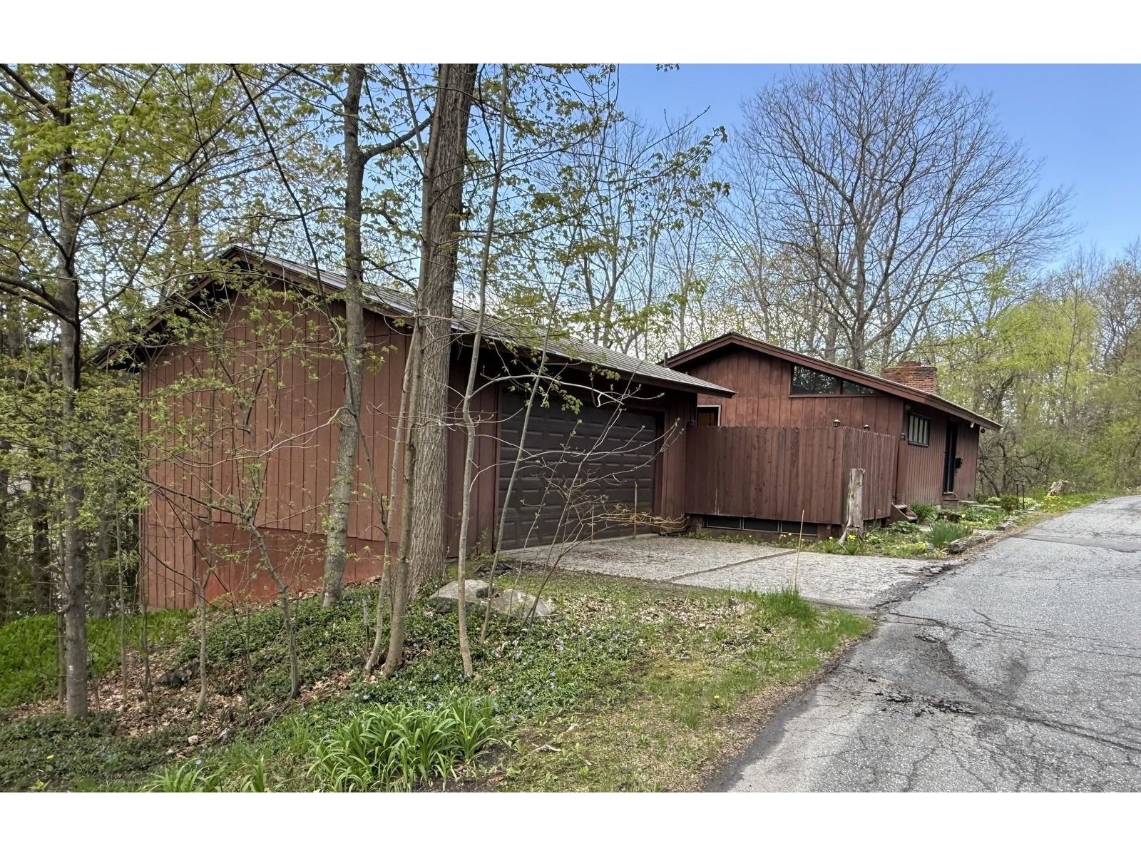 House and garage from east