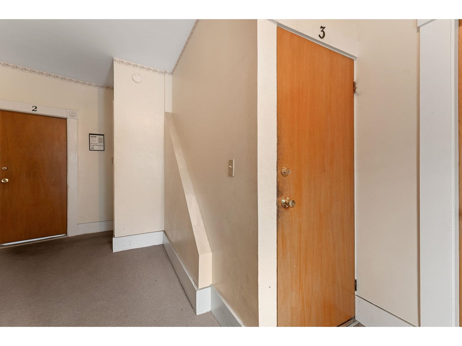Hallway with entry to units 2 & 3