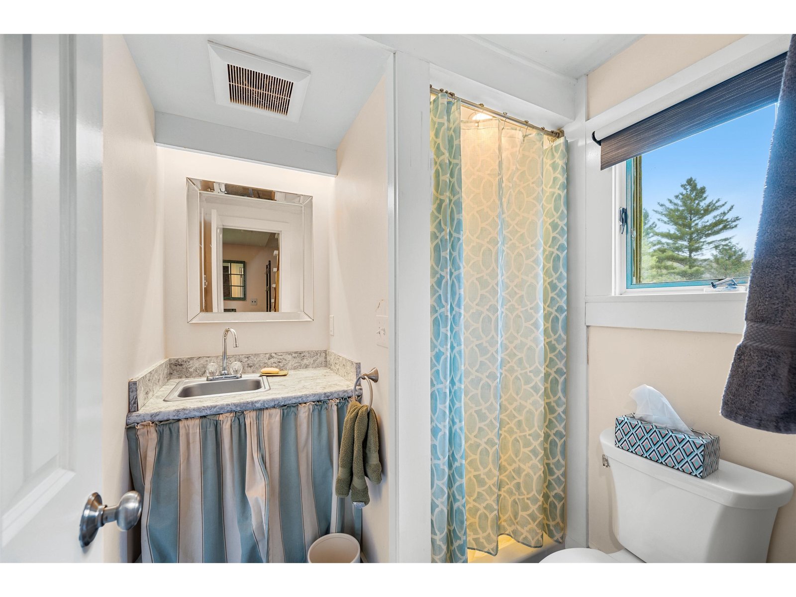 main floor 3/4 bath by entry / laundry