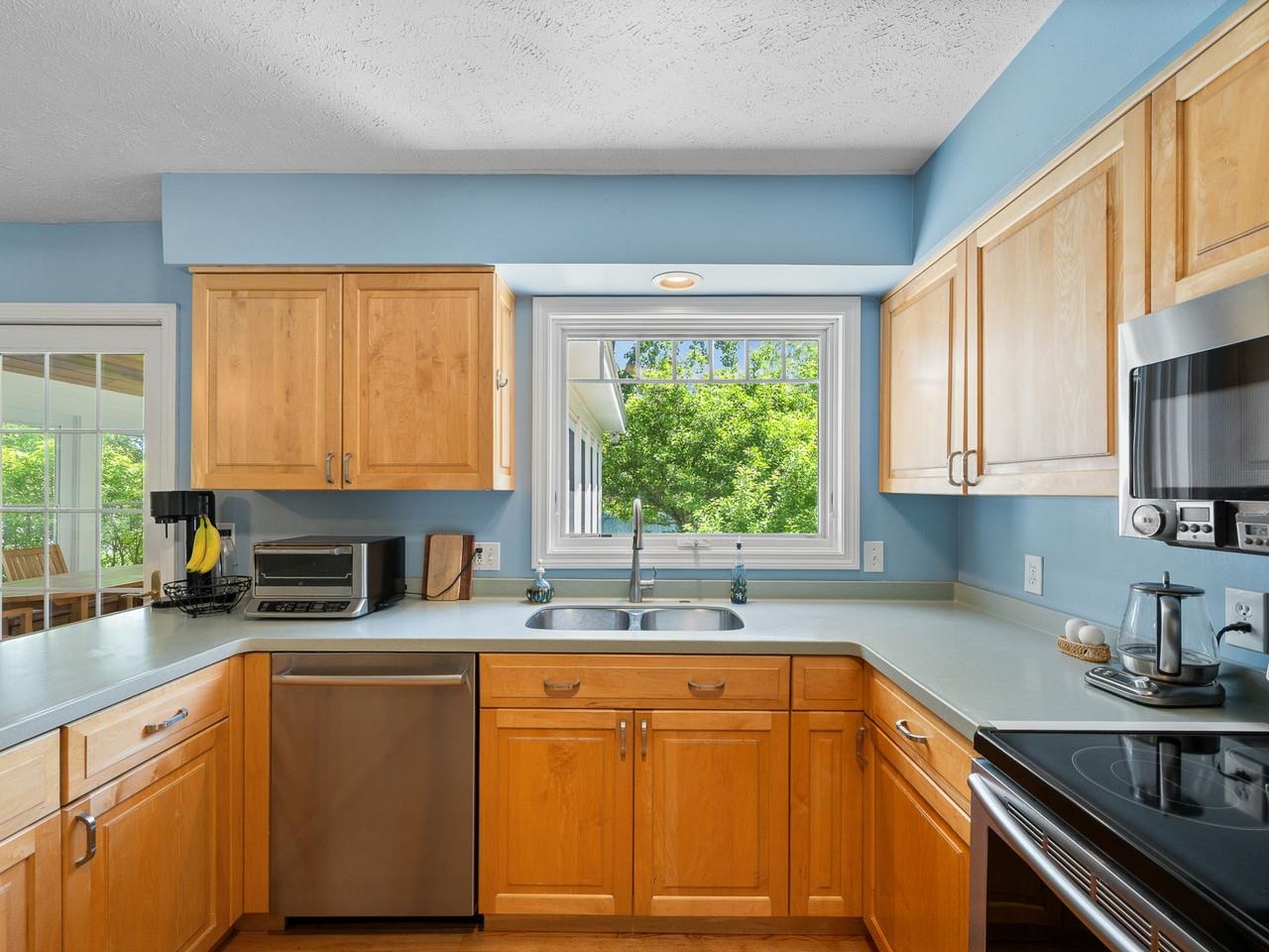 Kitchen overlooks backyard