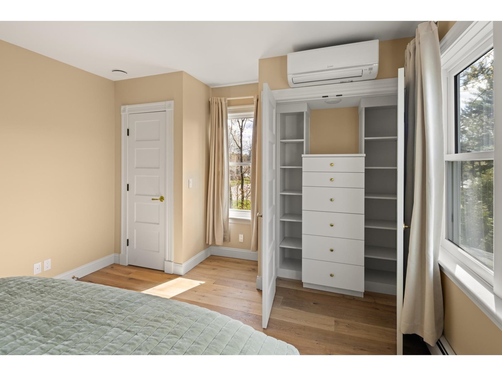 Custom closet in primary bedroom