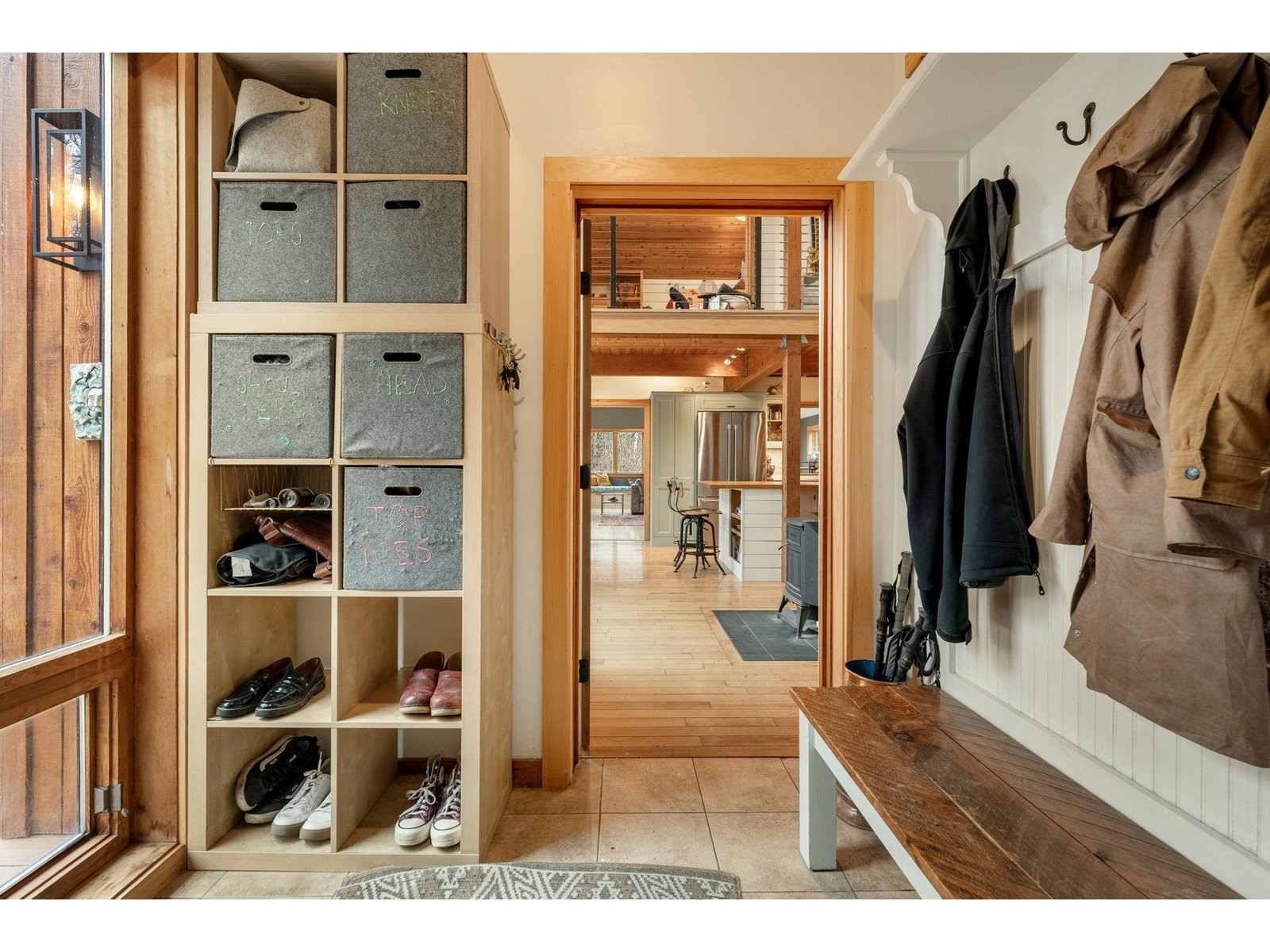 Large and functional mudroom leading to kitchen/dining area