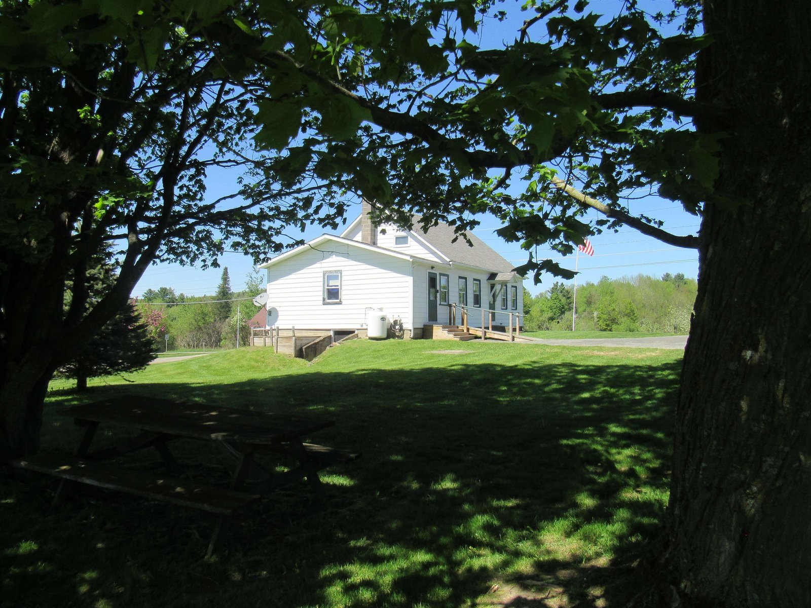 From Mature Shade Trees Looking Back at the House