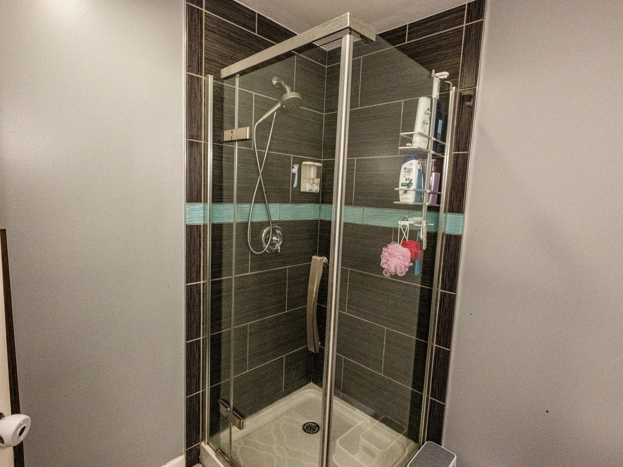 With tiled shower