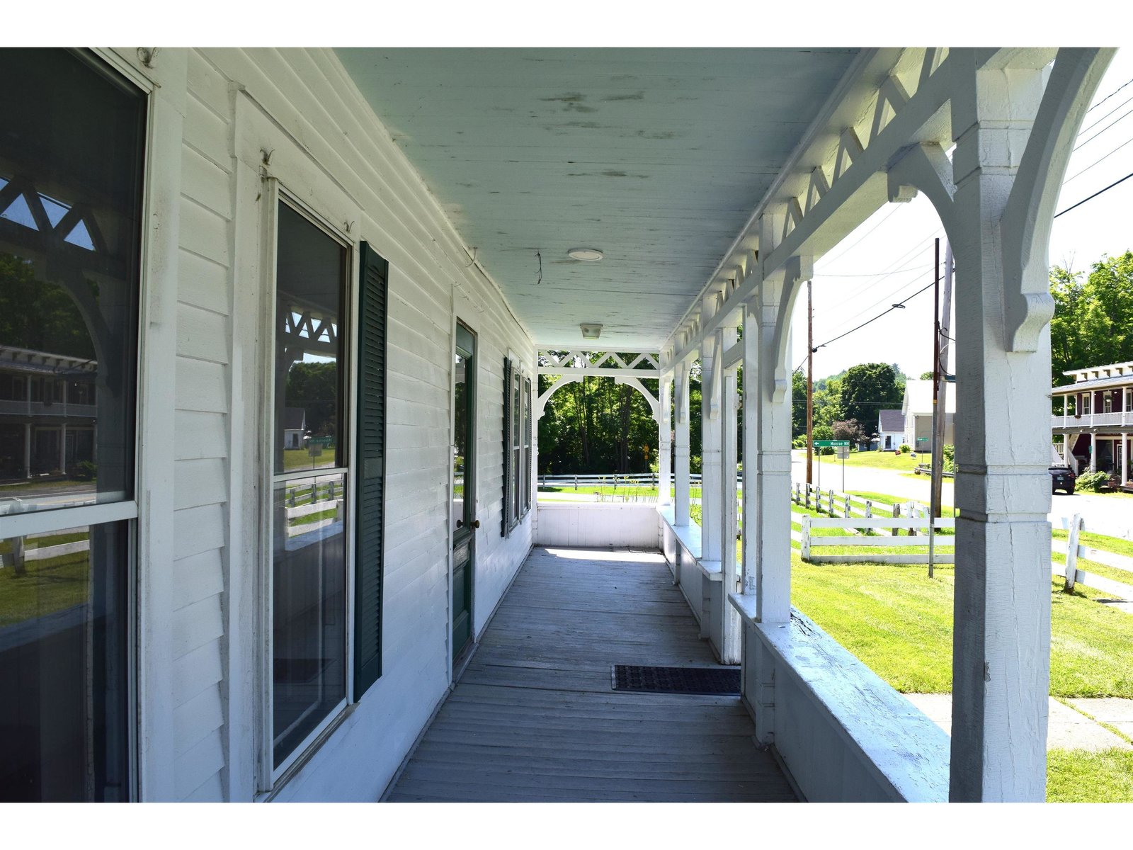 Full length covered porch ready for your chairs