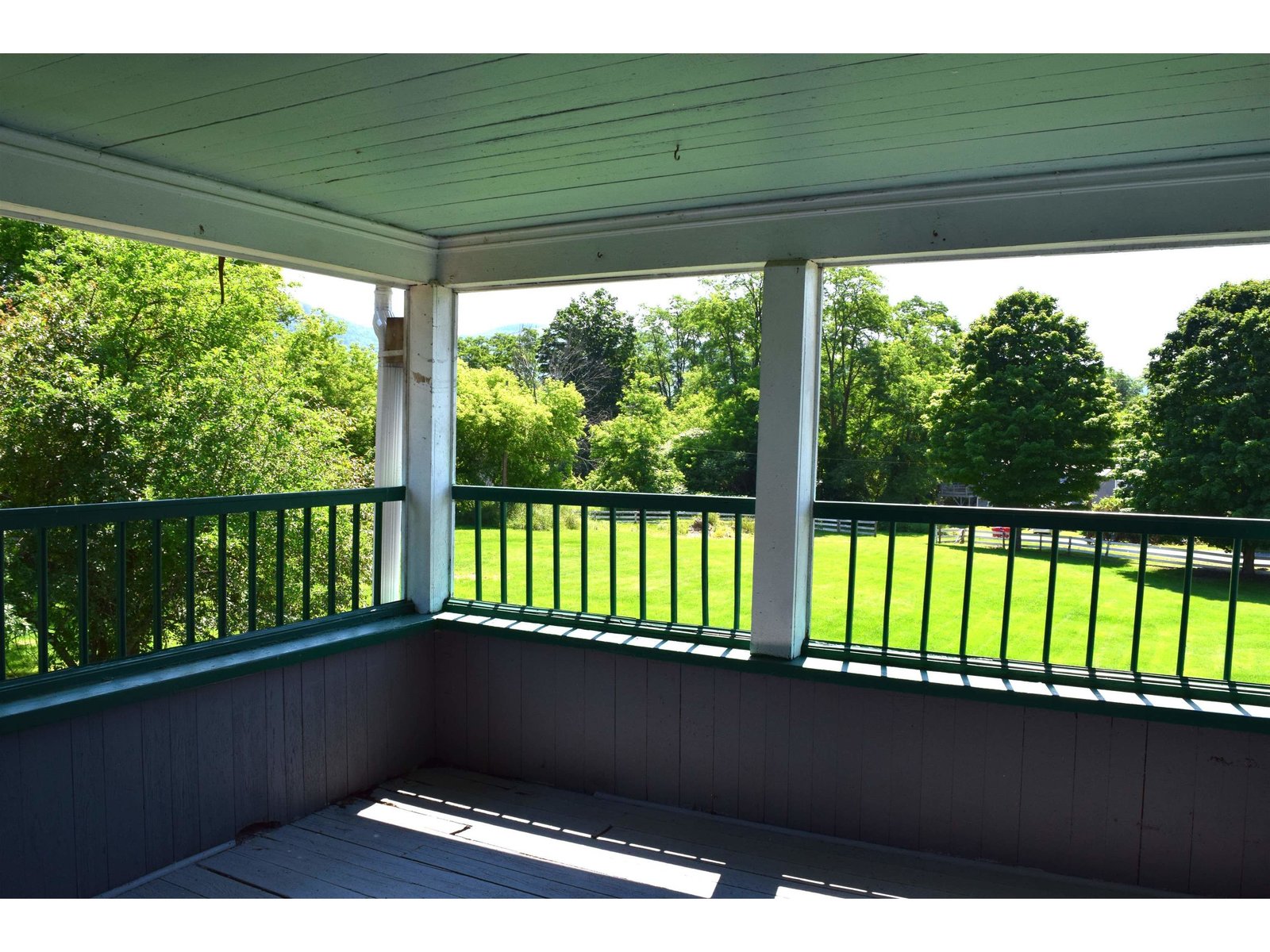 2nd floor covered porch with views toward the backyard