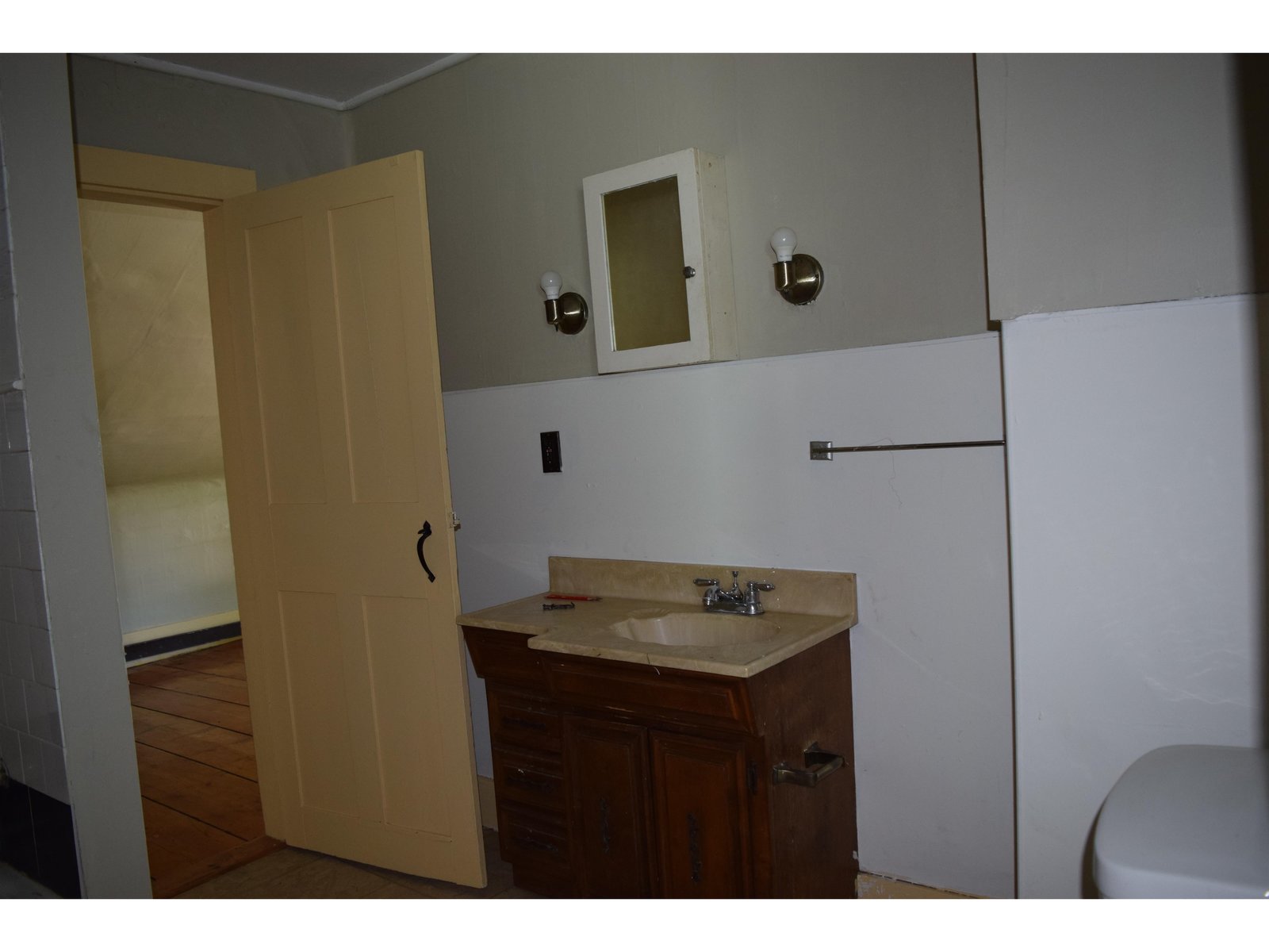 Bathroom accessed from living space and bedroom space